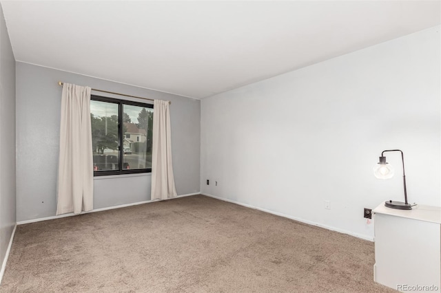 401 S Kalispell Way Unit 104, Aurora, CO 80017 - carpeted spare room featuring baseboards