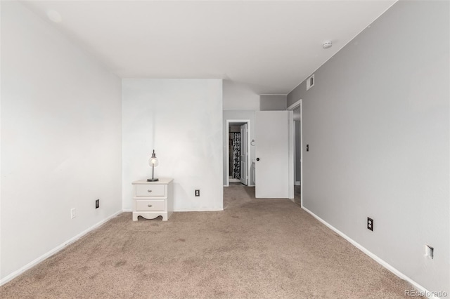 401 S Kalispell Way Unit 104, Aurora, CO 80017 - empty room with carpet floors and a smoke detector