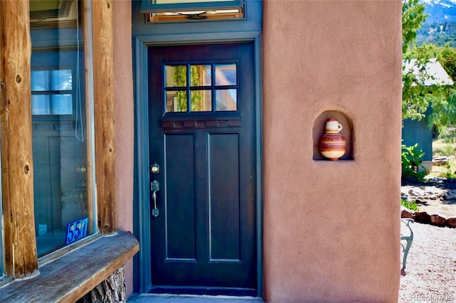 551 Panorama Way, Crestone, CO 81131 - property entrance featuring stucco siding