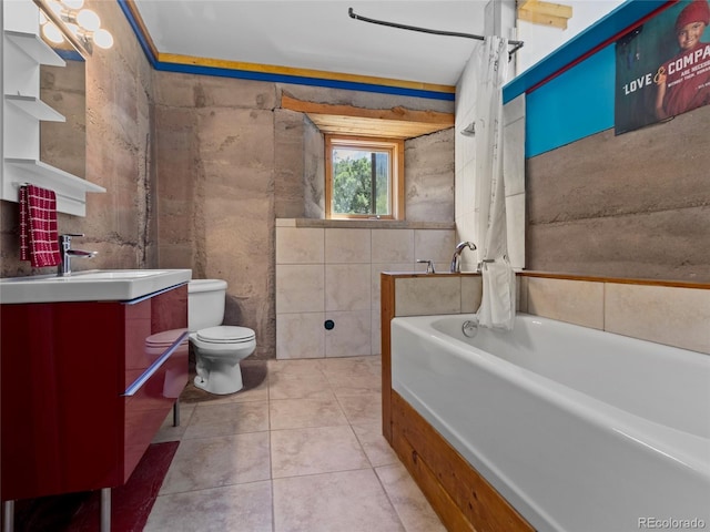 551 Panorama Way, Crestone, CO 81131 - full bathroom featuring vanity, a tub to relax in, tile patterned flooring, and tile walls