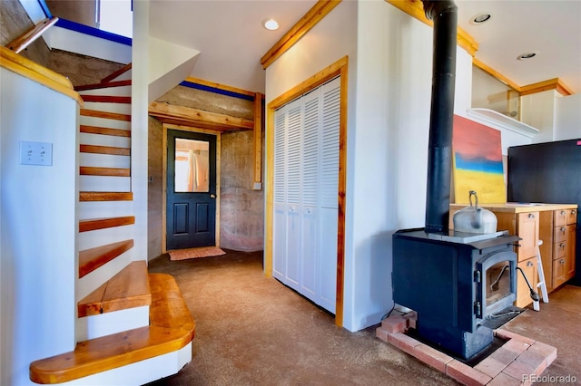 551 Panorama Way, Crestone, CO 81131 - entryway with a wood stove, finished concrete floors, and recessed lighting