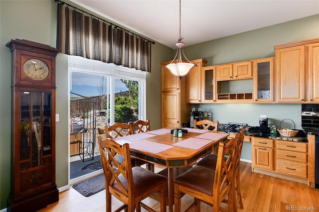 dining area featuring light wood-style flooring