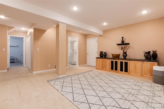 interior space with light colored carpet, recessed lighting, and baseboards