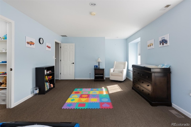 playroom with dark colored carpet