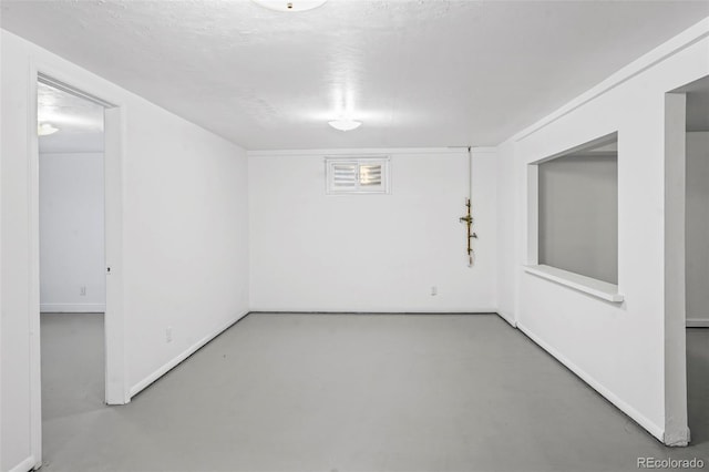 basement with a textured ceiling