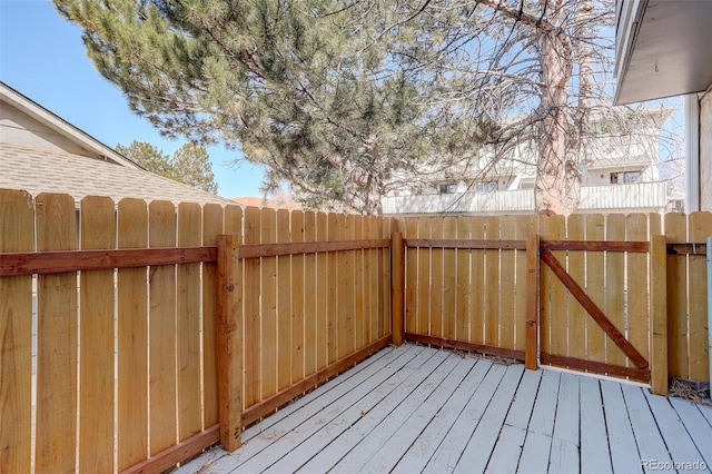 deck featuring a gate and fence