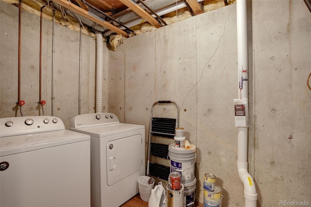 clothes washing area featuring washing machine and dryer and laundry area