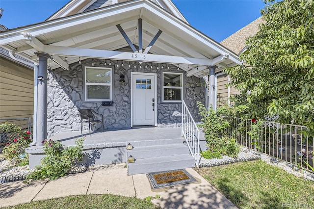 entrance to property featuring a porch