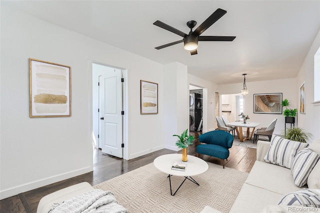 living room featuring ceiling fan and wood-type flooring