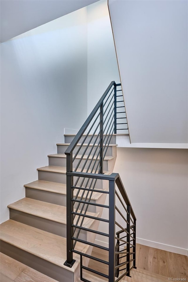 stairway with wood-type flooring