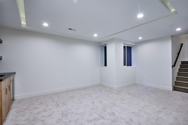 basement with light colored carpet