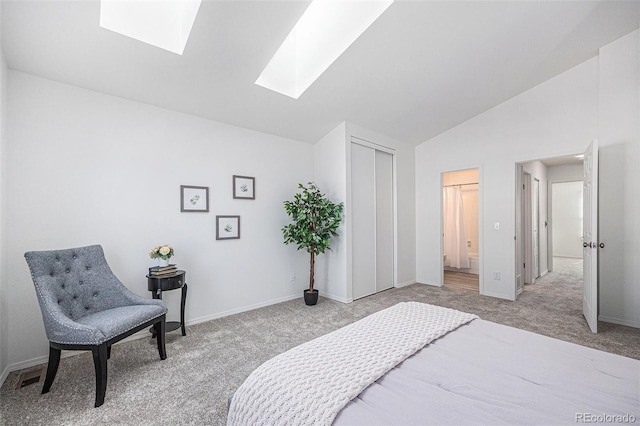 6774 S Independence St, Littleton, CO 80128 - bedroom with light colored carpet, a skylight, lofted ceiling, ensuite bath, and a closet