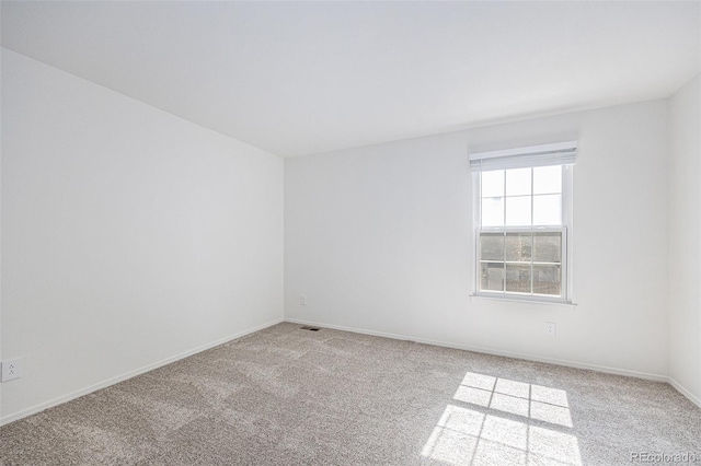 6774 S Independence St, Littleton, CO 80128 - spare room featuring light carpet and baseboards