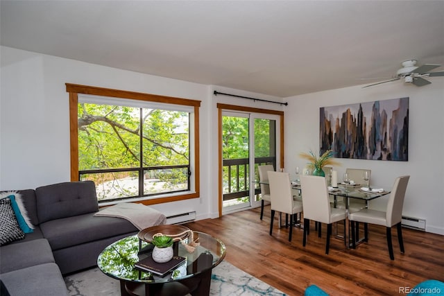 827 Maxwell Ave Unit H, Boulder, CO 80304 - living area featuring a baseboard heating unit, healthy amount of natural light, and wood finished floors