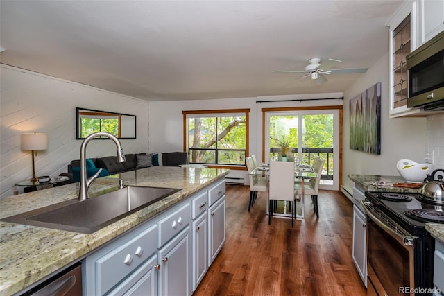 827 Maxwell Ave Unit H, Boulder, CO 80304 - kitchen with a sink, appliances with stainless steel finishes, a ceiling fan, dark wood finished floors, and light stone countertops