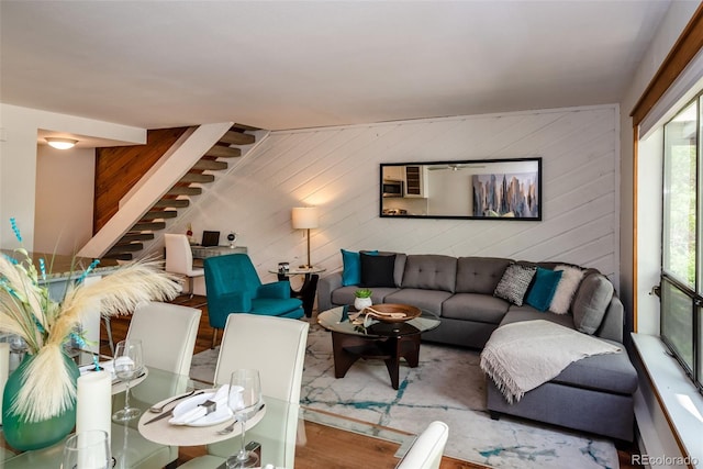 827 Maxwell Ave Unit H, Boulder, CO 80304 - living area featuring stairs, wood finished floors, and wood walls