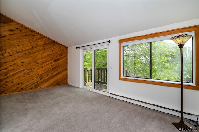 827 Maxwell Ave Unit H, Boulder, CO 80304 - carpeted spare room featuring a baseboard radiator, wooden walls, and lofted ceiling