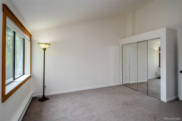 827 Maxwell Ave Unit H, Boulder, CO 80304 - unfurnished bedroom with multiple windows, carpet, baseboard heating, baseboards, and high vaulted ceiling