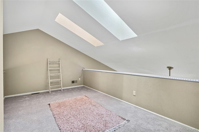1099 S Walden Way Unit 205, Aurora, CO 80017 - additional living space with a skylight, lofted ceiling, and carpet flooring