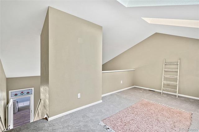1099 S Walden Way Unit 205, Aurora, CO 80017 - bonus room featuring vaulted ceiling, carpet flooring, and a skylight