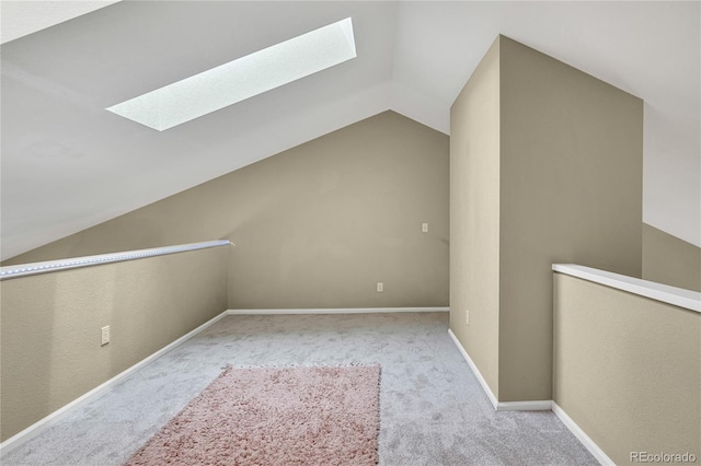 1099 S Walden Way Unit 205, Aurora, CO 80017 - additional living space with a skylight, vaulted ceiling, and carpet floors