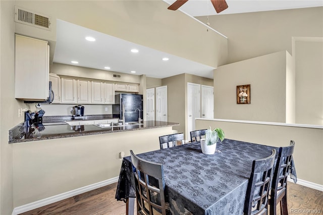 1099 S Walden Way Unit 205, Aurora, CO 80017 - dining area featuring wood finished floors, a ceiling fan, and recessed lighting