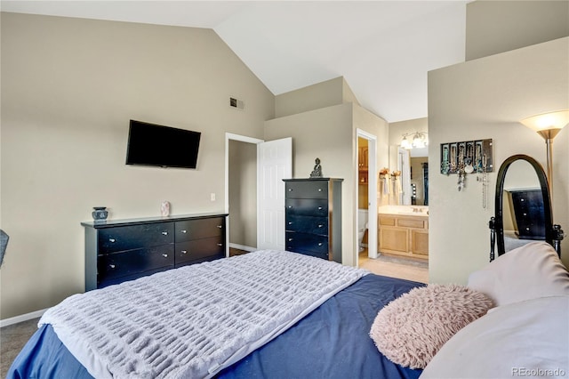 1099 S Walden Way Unit 205, Aurora, CO 80017 - bedroom with carpet floors, high vaulted ceiling, and connected bathroom