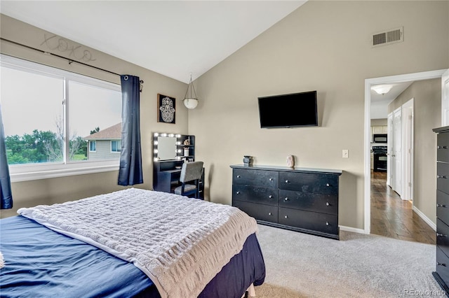 1099 S Walden Way Unit 205, Aurora, CO 80017 - carpeted bedroom featuring baseboards and high vaulted ceiling