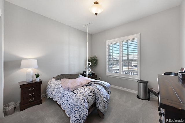 bedroom with carpet and baseboards