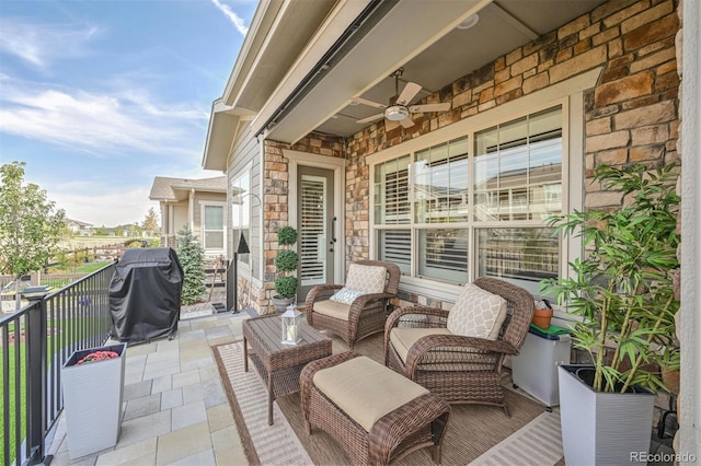 view of patio / terrace with ceiling fan and area for grilling