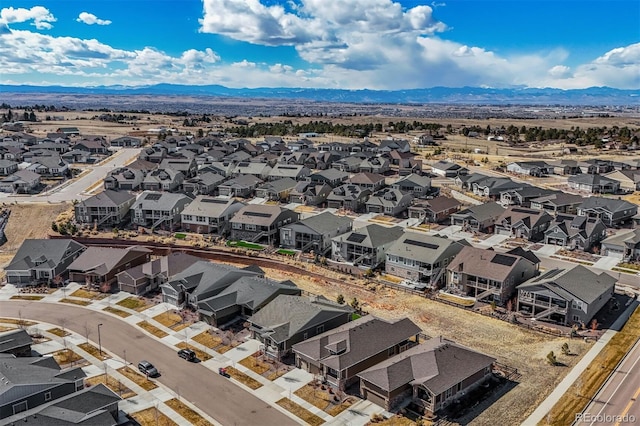 drone / aerial view with a residential view and a mountain view