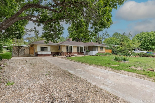 5810 S Greenwood St, Littleton, CO 80120 - ranch-style house featuring brick siding, driveway, and a chimney