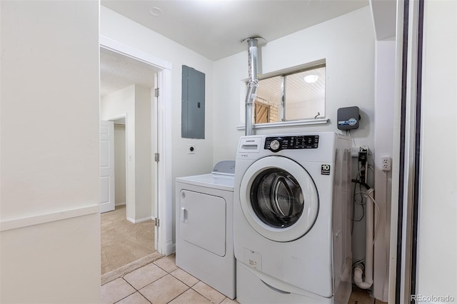 5810 S Greenwood St, Littleton, CO 80120 - laundry area with electric panel, washer and clothes dryer, light colored carpet, light tile patterned flooring, and baseboards