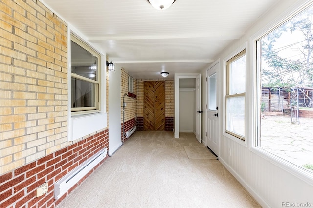 5810 S Greenwood St, Littleton, CO 80120 - unfurnished sunroom with brick wall, carpet, and a baseboard heating unit
