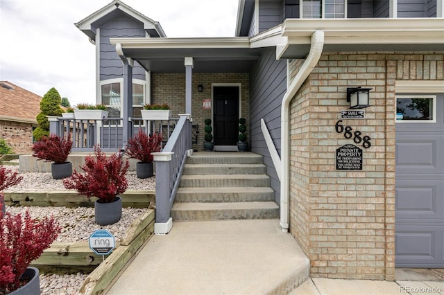 6888 Howell St, Arvada, CO 80004 - entrance to property with covered porch and brick siding