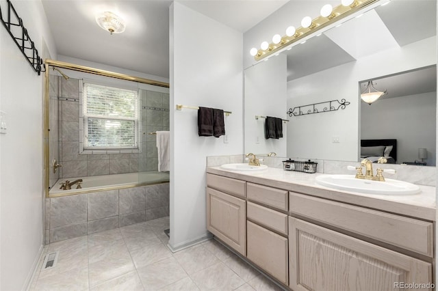 6888 Howell St, Arvada, CO 80004 - full bath with double vanity, tiled shower / bath, and tile patterned floors
