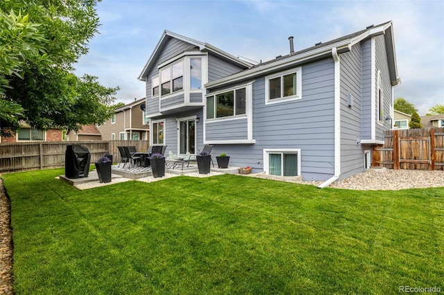 6888 Howell St, Arvada, CO 80004 - back of house with a patio area and a fenced backyard