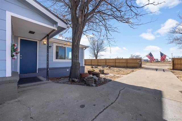 entrance to property with a patio area