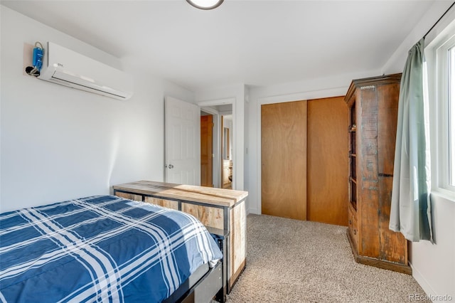 carpeted bedroom featuring a wall mounted air conditioner and a closet