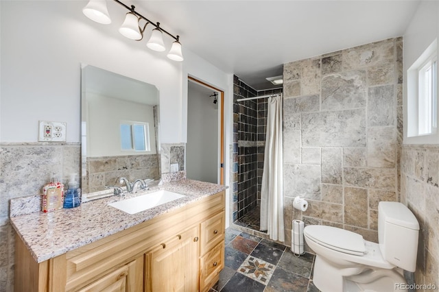 bathroom with vanity, tile walls, and curtained shower