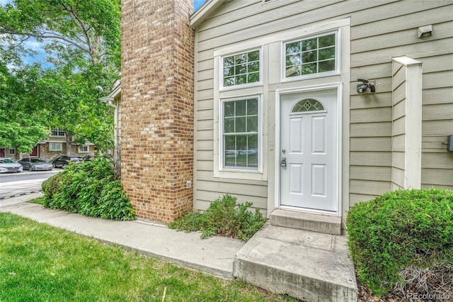1148 S Ventura Cir Unit H, Aurora, CO 80017 - entrance to property featuring a chimney
