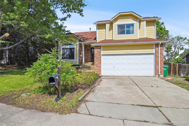 10525 Hobbit Ln, Westminster, CO 80031 - traditional-style home featuring an attached garage, concrete driveway, and brick siding