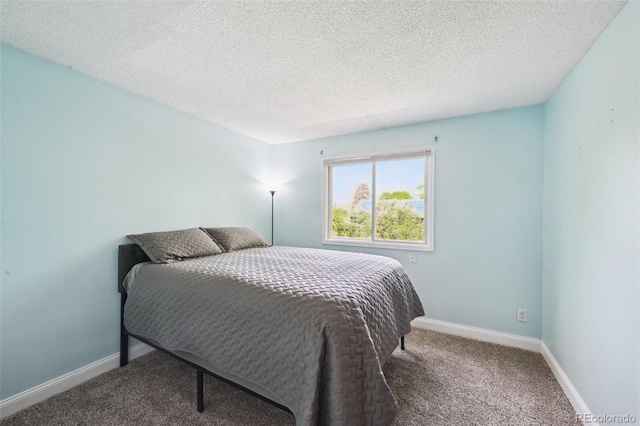 10525 Hobbit Ln, Westminster, CO 80031 - carpeted bedroom with a textured ceiling and baseboards