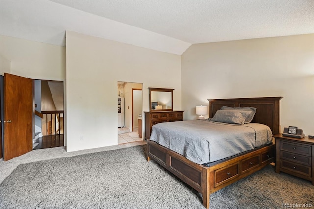 10525 Hobbit Ln, Westminster, CO 80031 - carpeted bedroom with lofted ceiling and fridge