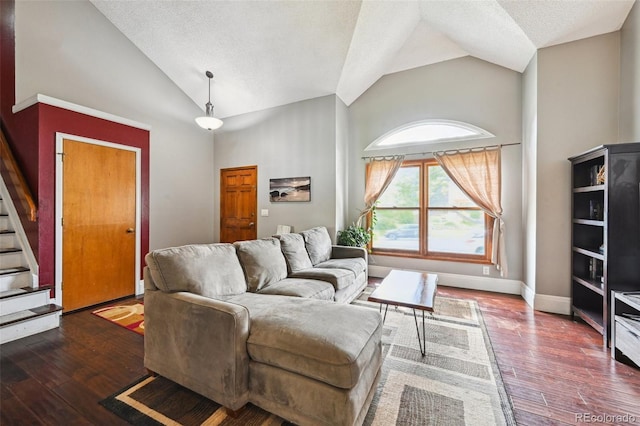 10525 Hobbit Ln, Westminster, CO 80031 - living room featuring high vaulted ceiling, stairs, a textured ceiling, and wood-type flooring
