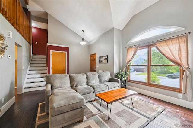 10525 Hobbit Ln, Westminster, CO 80031 - living room featuring high vaulted ceiling, hardwood / wood-style floors, and stairway