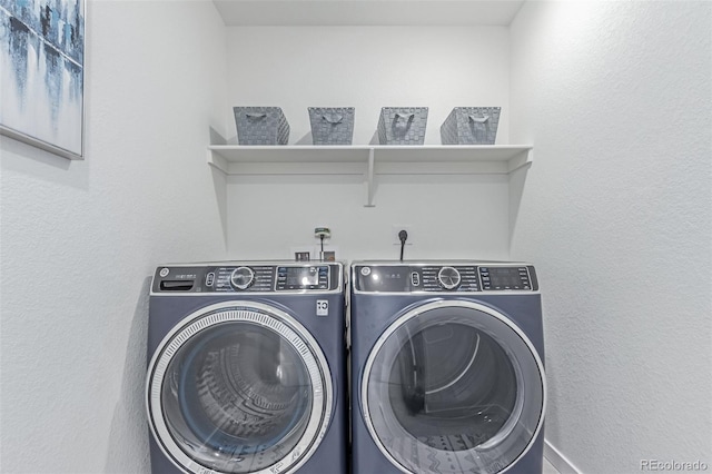 17825 Gallup St, Broomfield, CO 80023 - washroom with washing machine and clothes dryer and baseboards