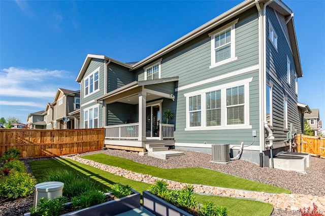 17825 Gallup St, Broomfield, CO 80023 - back of house with central AC unit, covered porch, and a residential view