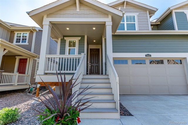 17825 Gallup St, Broomfield, CO 80023 - view of front of home featuring concrete driveway, covered porch, and a garage