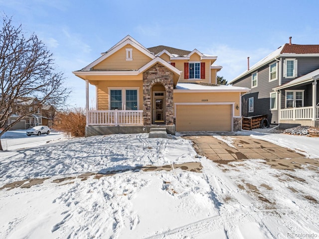 view of front of home featuring a porch and a garage